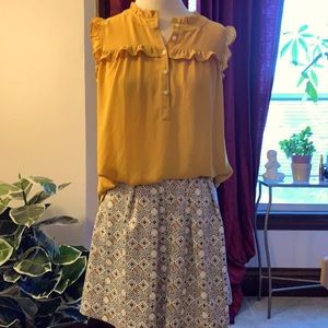 Light sleeveless mustard button down